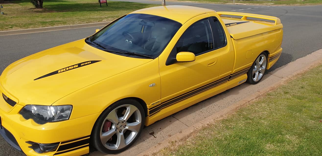 Yellow FPV Boss 290 ute parked on a country street